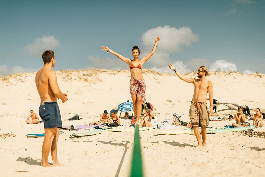 Guests playing on the beach in Soulac-sur-Mer during a surf camp activity