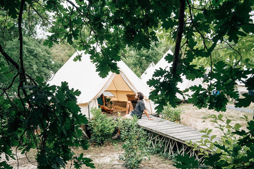 Glamping tents surrounded by trees at Dreamsea France Soulac-sur-Mer