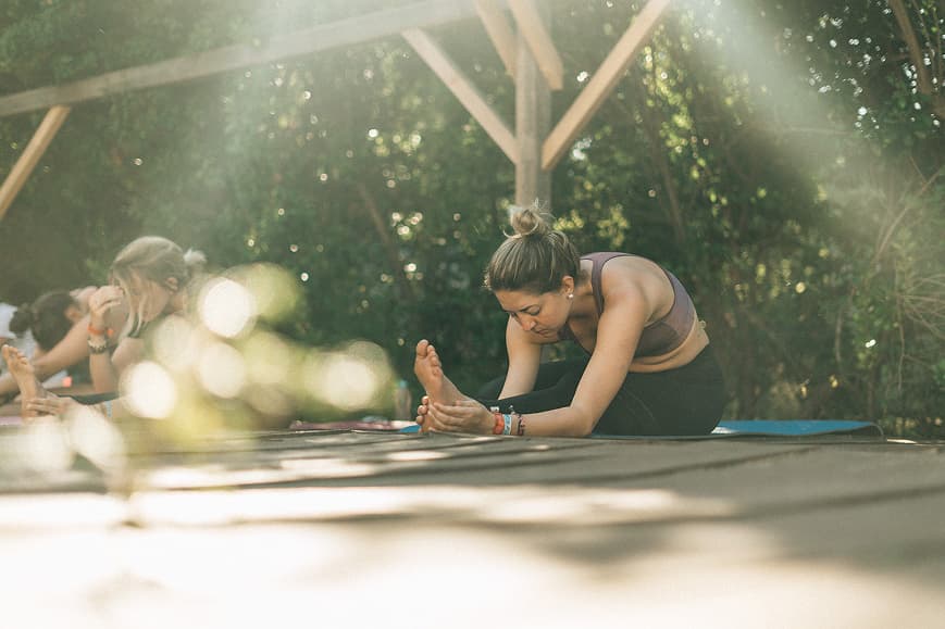 Guests stretching during an outdoor yoga class at Dreamsea France