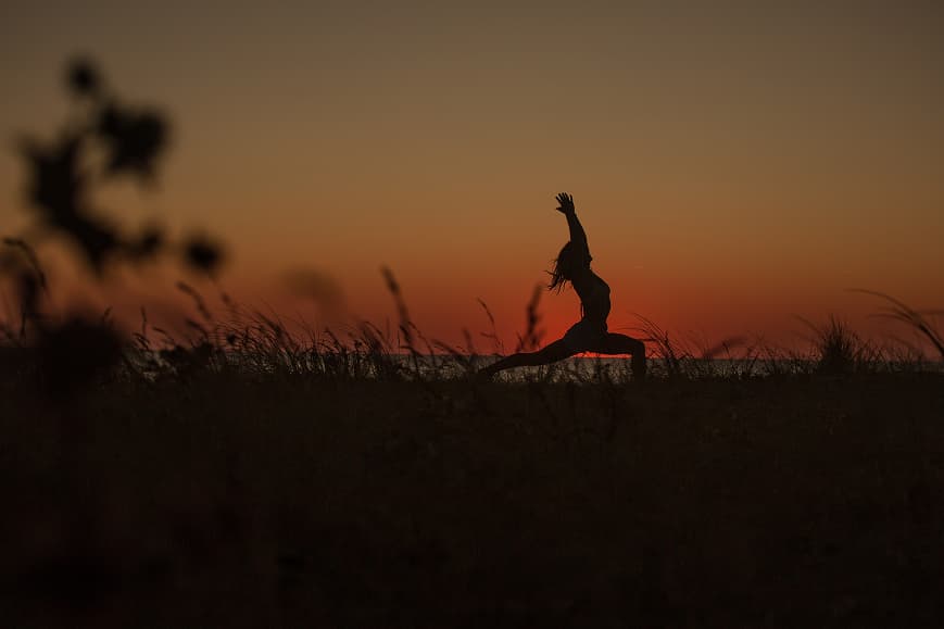 Guest practicing yoga at sunset near the beach in Soulac-sur-Mer