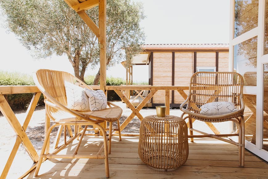 Private bungalow terrace at Dreamsea Portugal Alentejo with rattan chairs and wooden deck