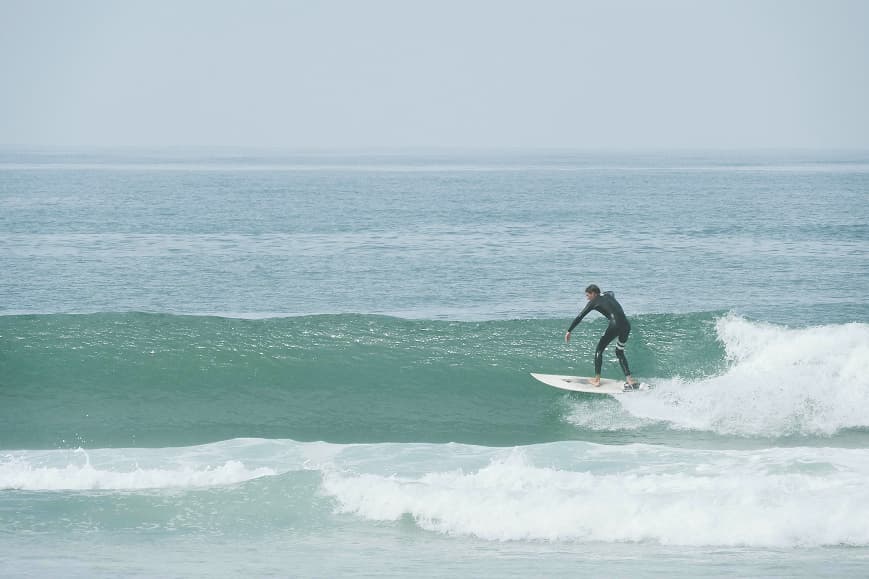 Surfer riding a clean wave on the Portuguese Atlantic coast near Praia da Tocha