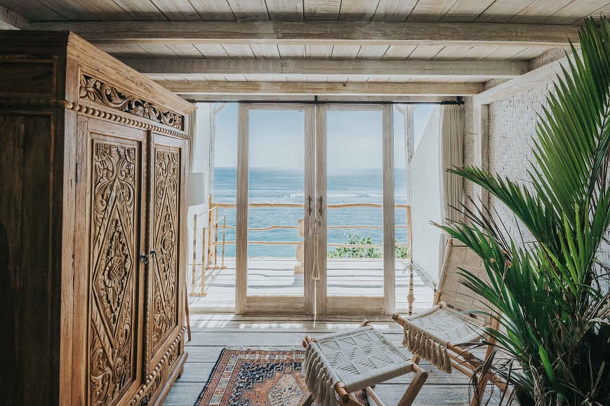 Balinese-style room at Dreamsea Bali Uluwatu with ocean views from the terrace