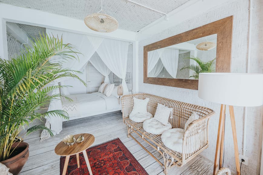 Bright private room at Dreamsea Bali Uluwatu with canopy bed and natural decor