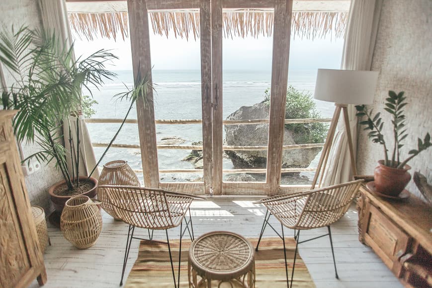 Seating area inside a Dreamsea Bali Uluwatu room overlooking the ocean