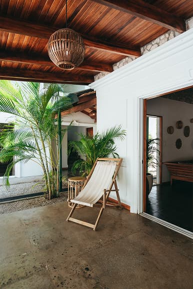 Private room terrace at Dreamsea Costa Rica Avellanas with tropical plants and lounge chair