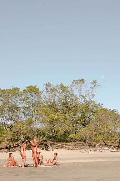 Guests relaxing together on the beach in Santa Teresa Costa Rica