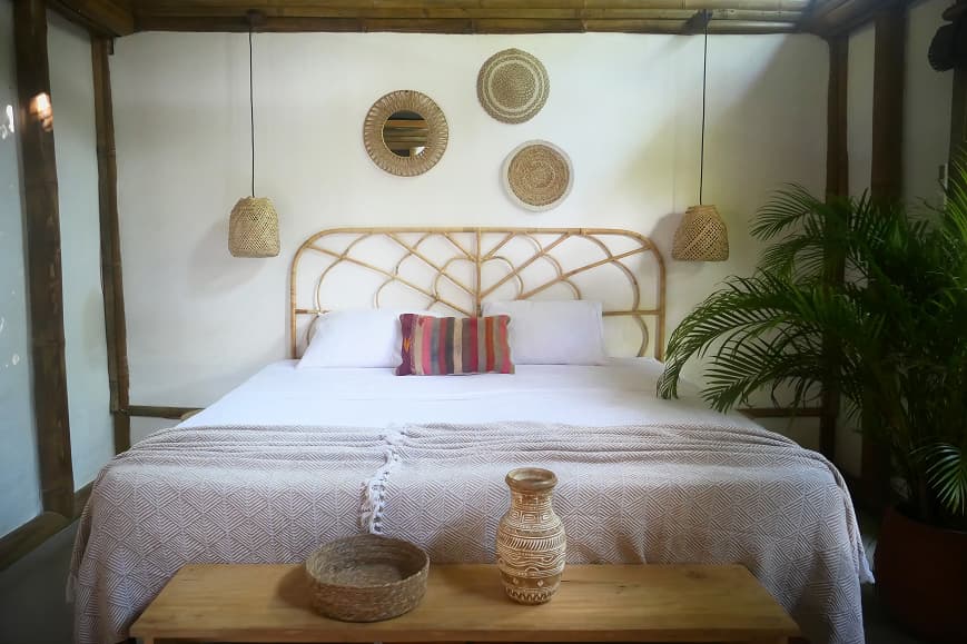 Private double room at Dreamsea Santa Teresa with natural wood and rattan decor