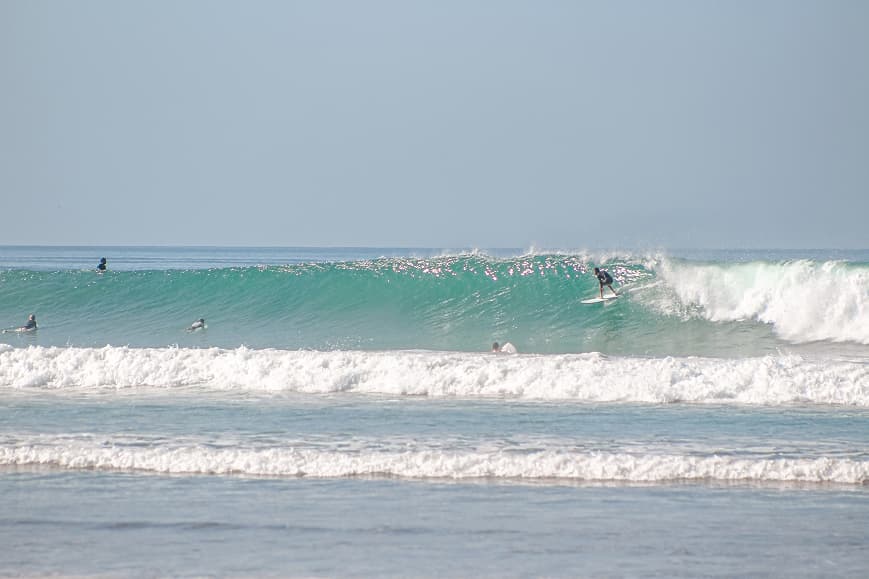 Surfer riding a powerful wave at Playa Hermosa Santa Teresa
