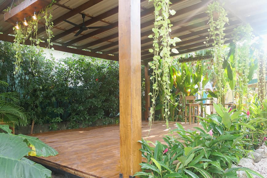 Open-air yoga shala at Dreamsea Santa Teresa surrounded by tropical plants