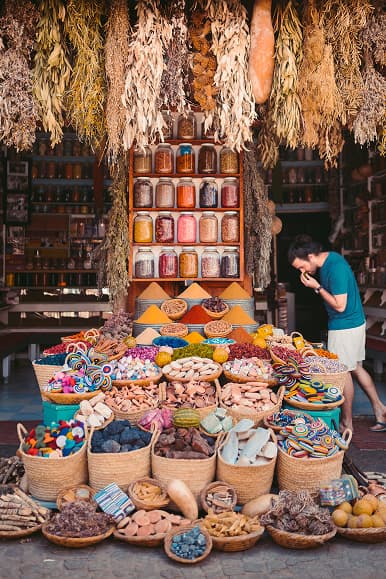 Colorful Moroccan market with spices, baskets and handmade crafts