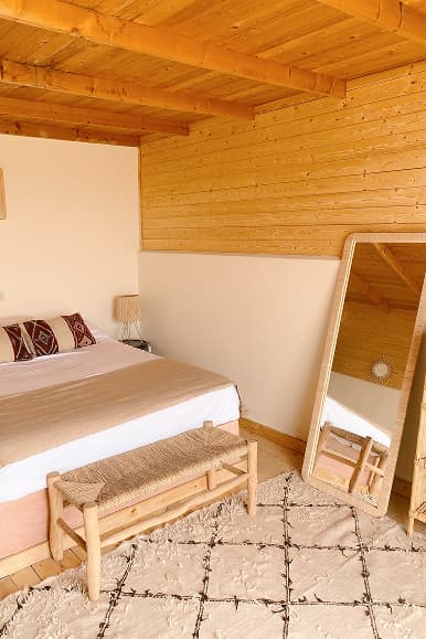 Bright double room at Dreamsea Morocco Imsouane with wooden ceiling and full-length mirror