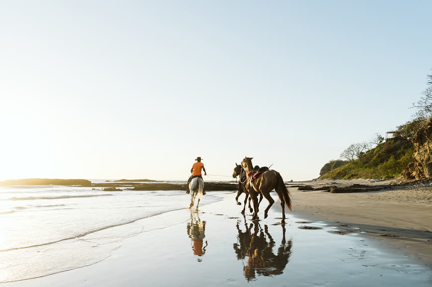 Horseback riding on the beach at sunset near San Juan del Sur Nicaragua