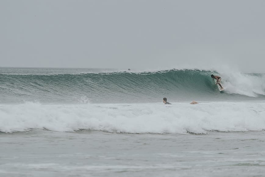 Surfer riding a powerful wave on the Pacific coast of Nicaragua