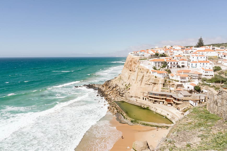 Cliffside village and Atlantic coastline near Sintra Portugal