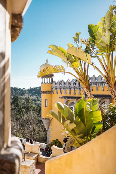 Pena Palace in Sintra Portugal framed by tropical plants