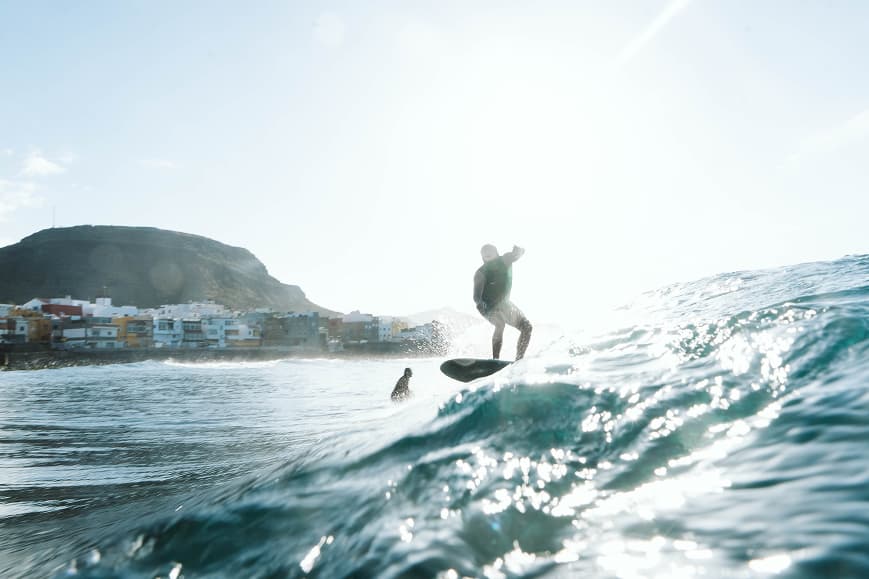 Surfer riding a wave near the coast of Gran Canaria