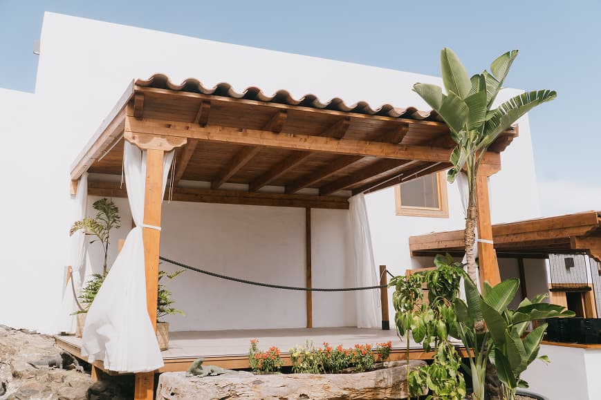 Open-air yoga deck at Dreamsea Gran Canaria with wooden roof and tropical plants